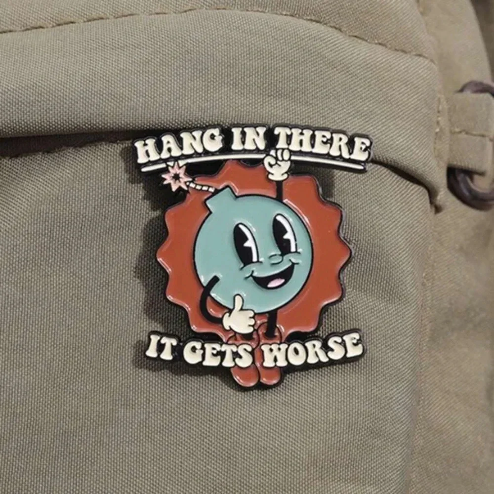 Blue red bomb Hang in There uplifting enamel pin backpack bag hat clothes denim